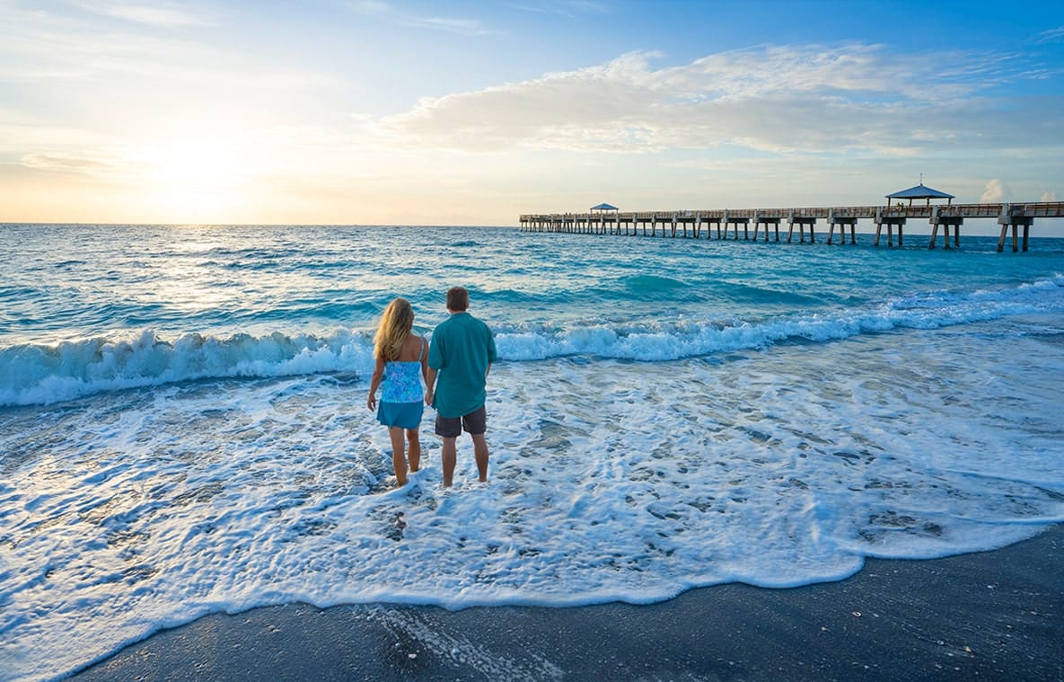 Tequesta Lifestyle couple holding hands on the tequesta jupiter beach